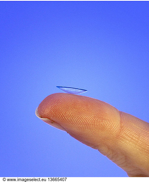 Contact lens on a fingertip.