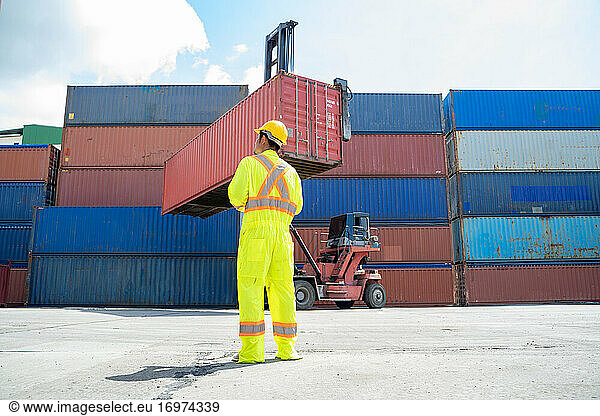 Container worker working at container cargo freight ship Busines