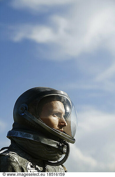Contemplative cosmonaut wearing astronaut costume