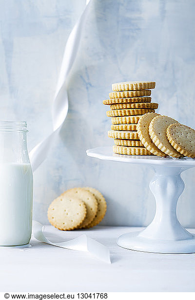 Cookies with milk bottle on table