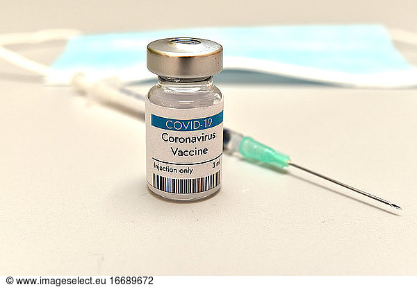 Coronavirus COVID-19 vaccine vial  container  bottle and syringe