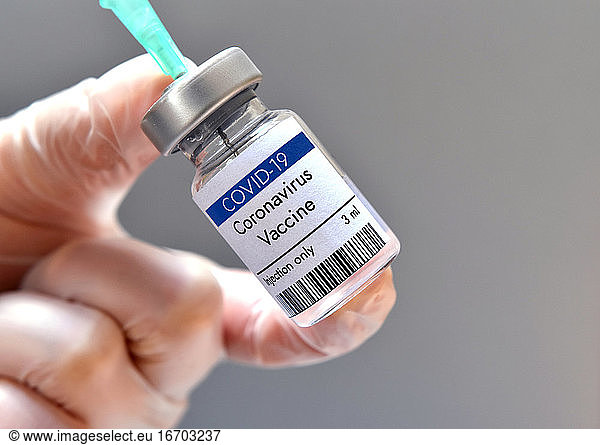 Coronavirus vaccine vial bottle in research laboratory. Close-up view