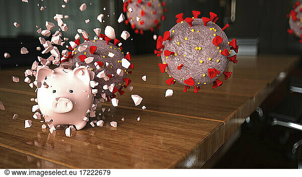 Coronavirus zerbricht Sparschwein auf Konferenztisch im Büro