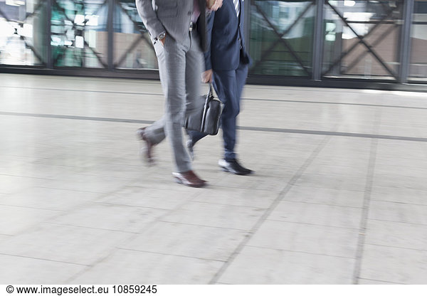 Corporate businessmen walking