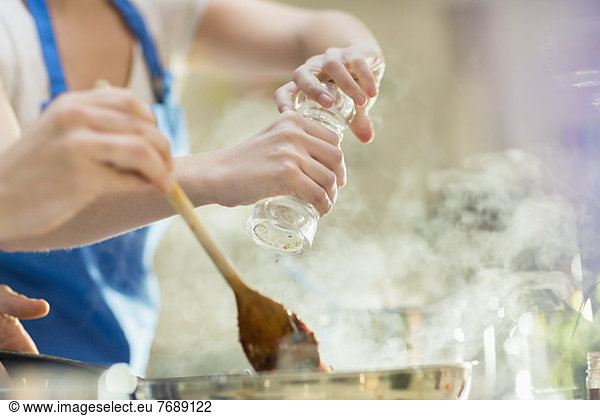 Couple cooking in kitchen