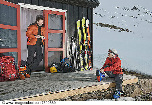 couple getting ready for ski touring at ski cottage in Iceland