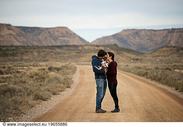 Couple holding and kissing in Bardenas Reales desert