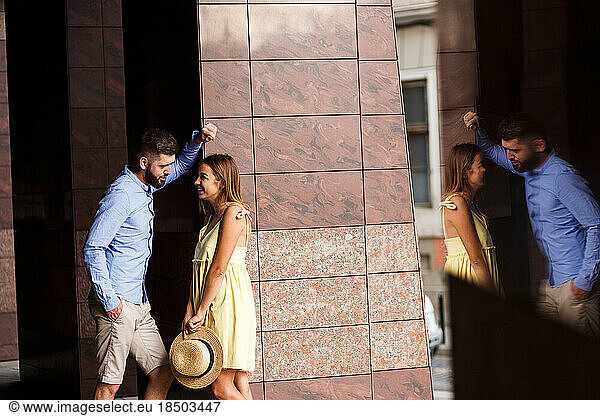 couple in love is tenderly embracing in the summer in city