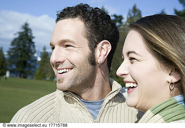 Couple Laughing In Park