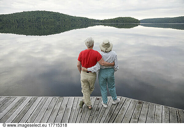 Couple Looking Out Over Lake  Algonquin Park  Ontario