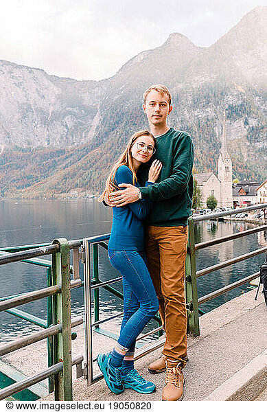 couple of tourists on the background of Lake Hallstatt Austria