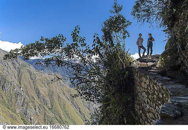 Couple on the Inca Trail path close to Machu Picchu