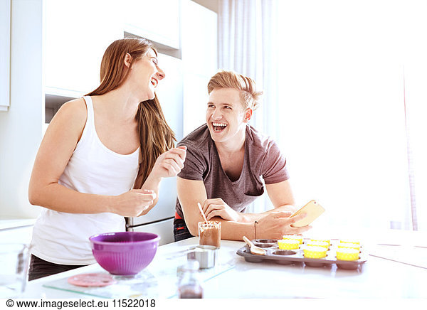 Couple preparing food in kitchen