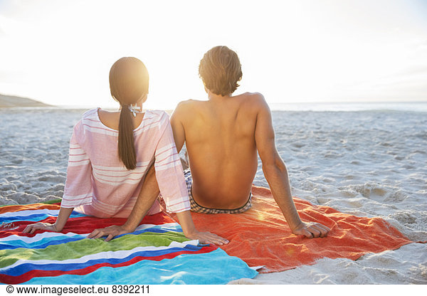 Couple relaxing on beach