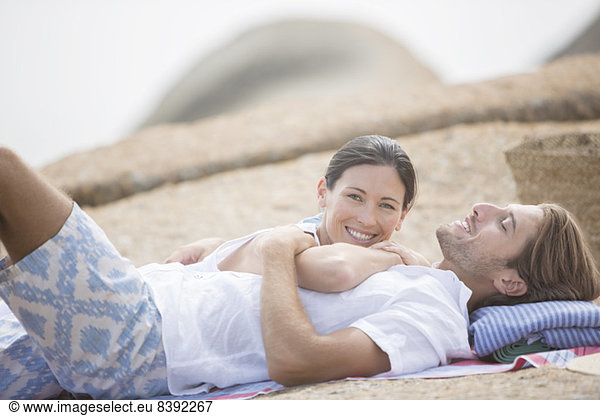Couple relaxing on beach together