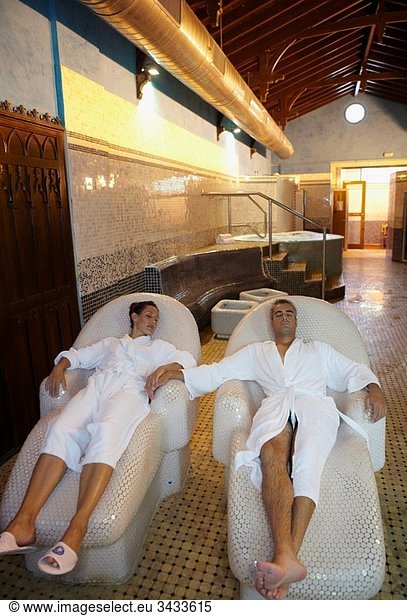 Couple relaxing on hot stone seats  spa-relais. Lierganes hotel and spa  Cantabria  Spain