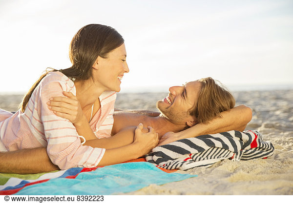 Couple relaxing together on beach