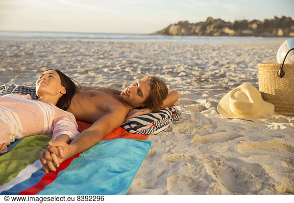 Couple relaxing together on beach