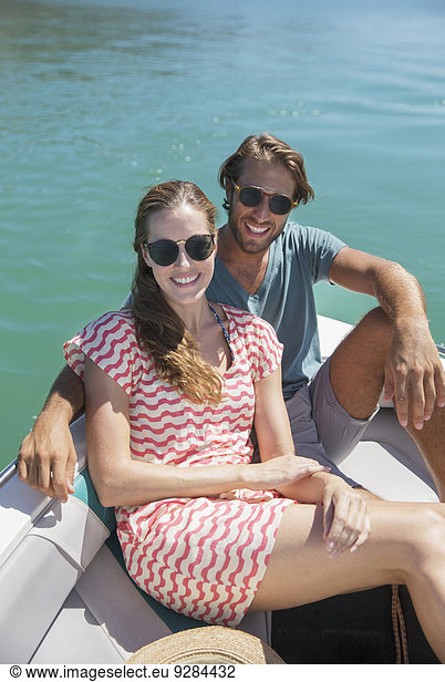 Couple sitting in boat on water