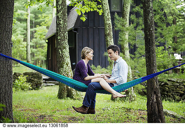 Couple sitting on hammock