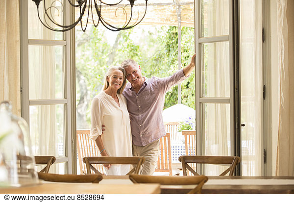 Couple smiling in doorway