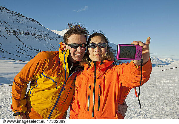 couple taking selfie with compact camera in Iceland