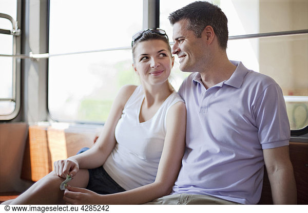 Couple travelling in funicular train