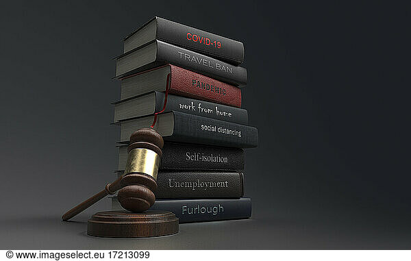 Covid legislation textbooks next to gavel