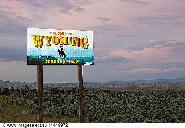 Cowboy on bucking bronco on Welcome to Wyoming sign  Wyoming  United States