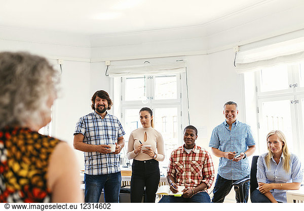 Coworkers during business meeting in office