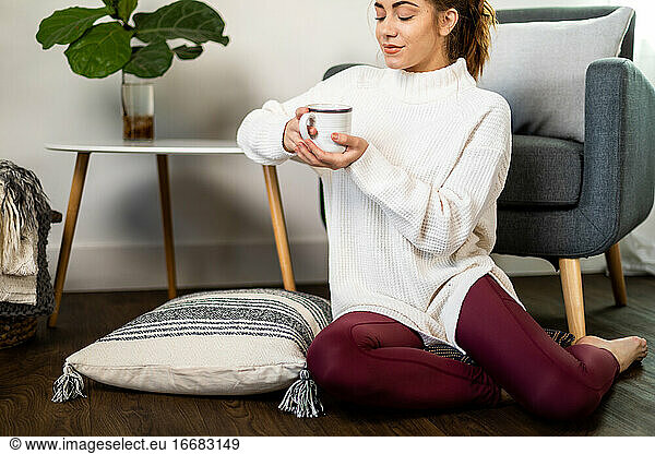 Cozy Woman Enjoys Coffee at Home