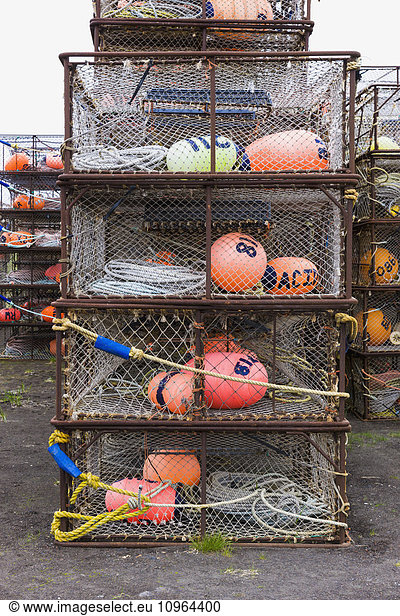 Crab pots and bouys stacked on shore  St. Paul Harbor  St. Paul Island  Southwestern Alaska  USA