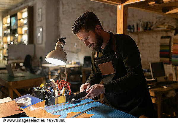 Craftsman preparing tools over workbench
