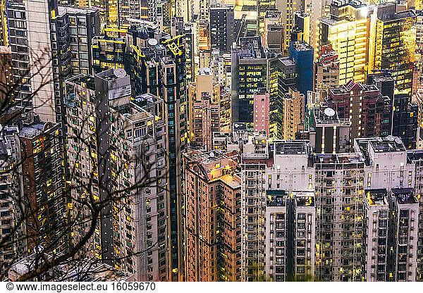 Crammed Hong Kong apartment blocks at dusk; Hong Kong  Hong Kong Special Administrative Region (SAR)  Hong Kong