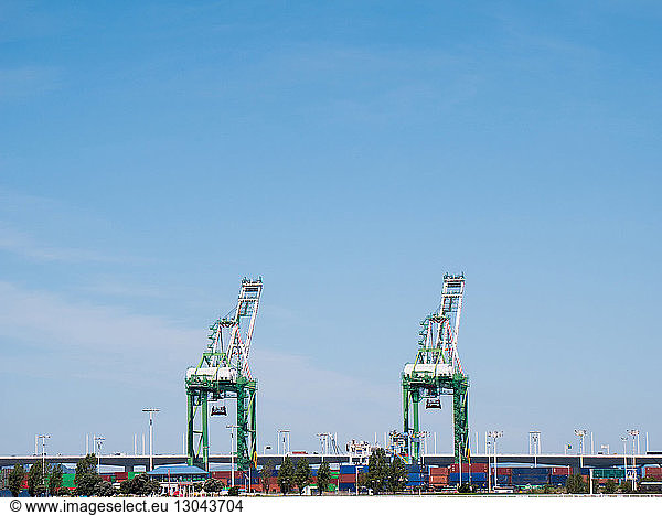 Cranes against sky at Port View Park
