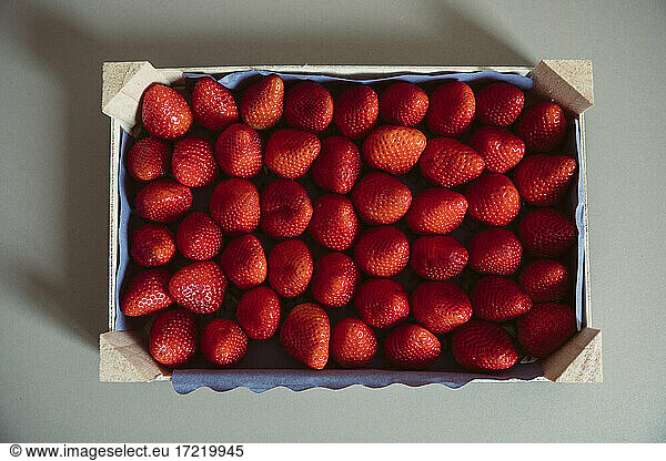 Crate of fresh ripe strawberries