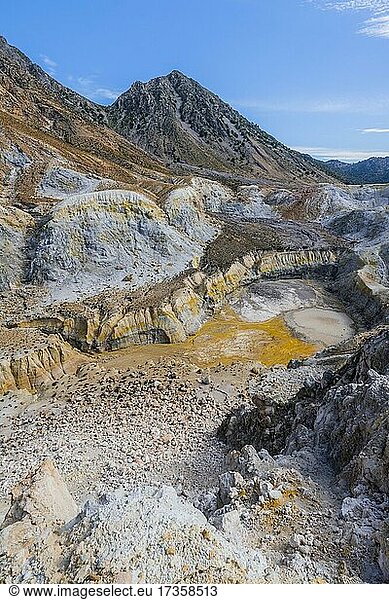 Crater with yellow discoloured sulphur stones and colourful mineral deposits  Caldera volcano with pumice fields  Alexandros crater  Nisyros  Dodecanese  Greece  Europe