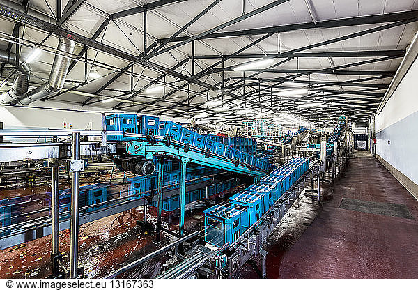 Crates of mineral water on bottling plant conveyor belt