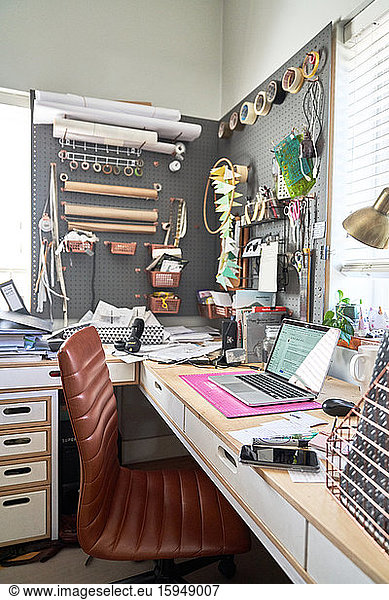 Creative home office with craft supplies