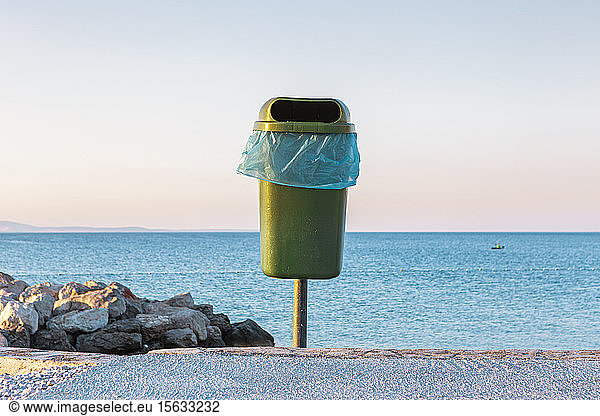 Croatia  Krk  trash bin against tranquil sea