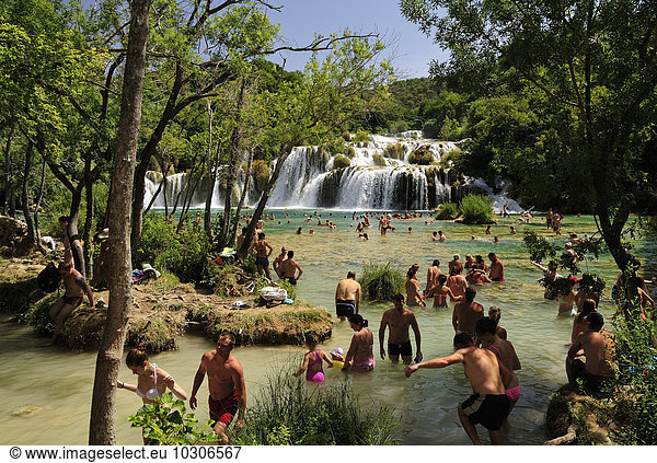 Croatia  Krka National Park  Skradinski buk  tourists bathing in pool at waterfall