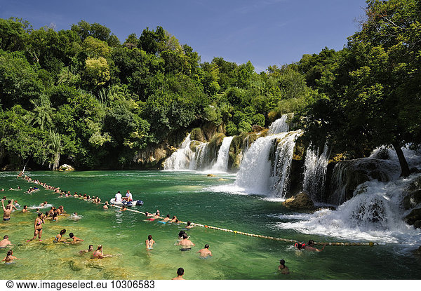 Croatia  Krka National Park  Skradinski buk  tourists bathing in pool at waterfall
