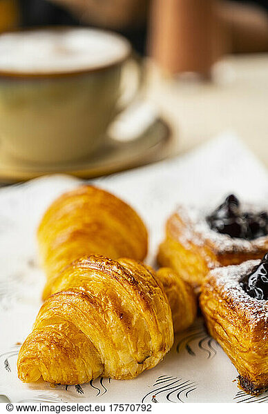 croissant and danish pastry on breakfast table