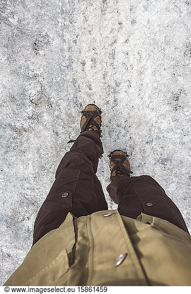Crop explorer walking on icy path