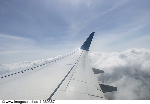 Cropped image of aircraft wing flying over cloudy sky  Western Province  Sri Lanka