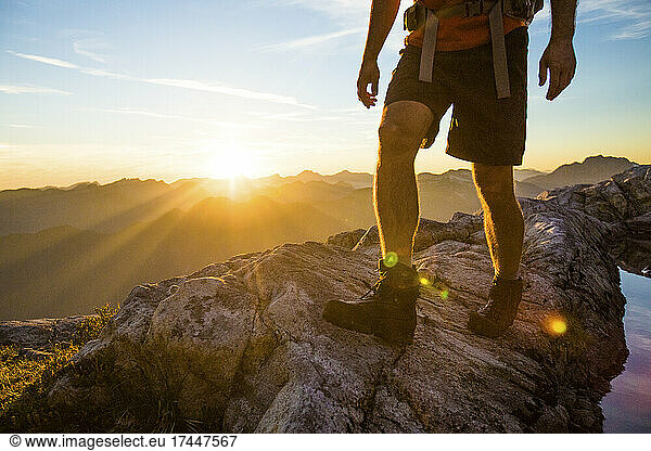 Cropped view of hiker on mountain ridge at sunset  Vancouver.
