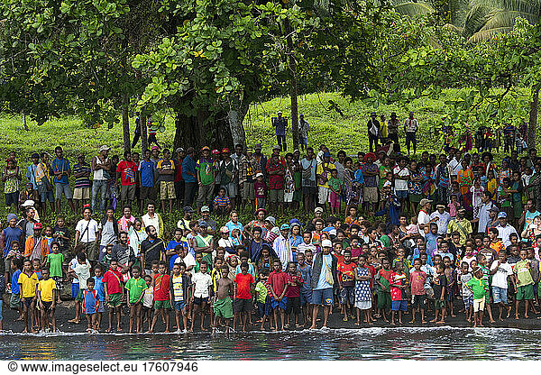 Crowd of villagers gathering to meet guests to Karkar Island  Papua New Guinea; Karkar  Madang Province  Papua New Guinea