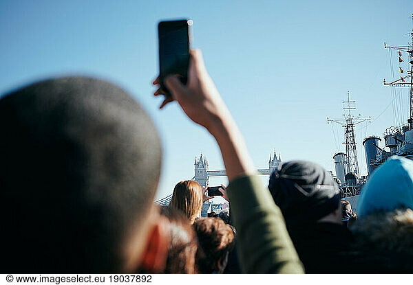 Crowd taking photos of Tower Bridge
