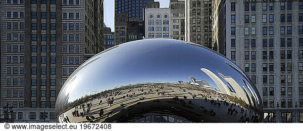 Crowds and Chicago skyline reflected by