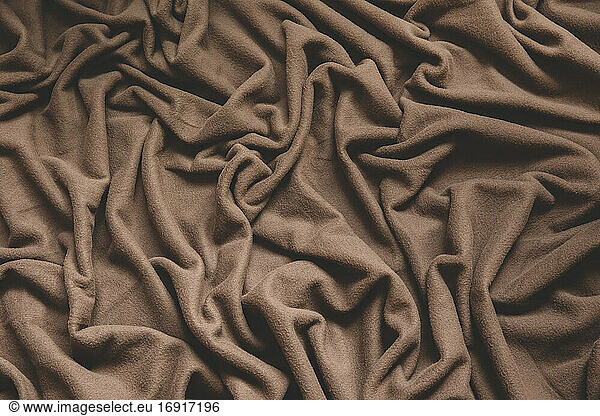 Crumpled brown fleece fabric